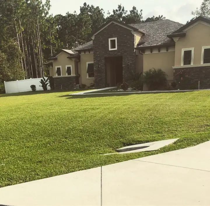 Freshly mowed and edged front lawn during rainy season